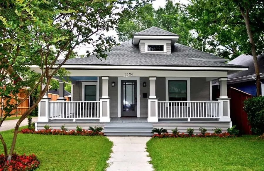 Finished gray Craftsman home with fresh exterior paint and white trim