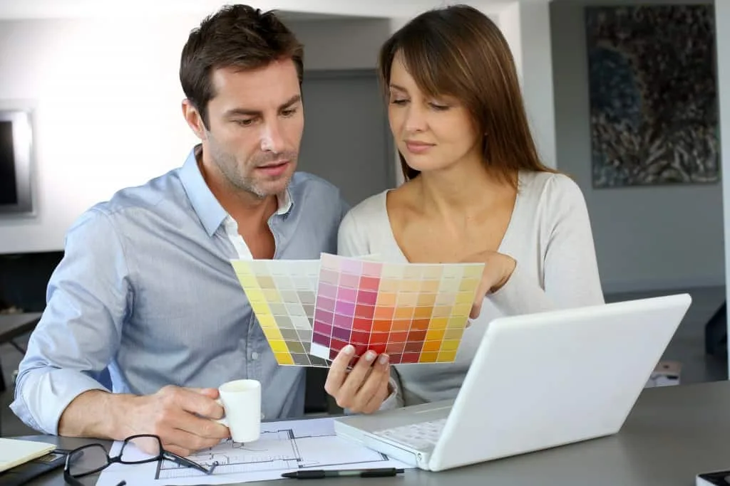 Homeowners reviewing paint colors during a Brush Brothers Painting consultation