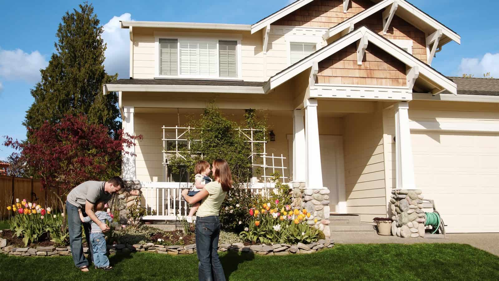 Family in front of newly painted home - Brush Brothers Painting NWA